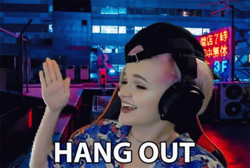 Woman With Headphones Says Hang Out In Front Of Building GIF