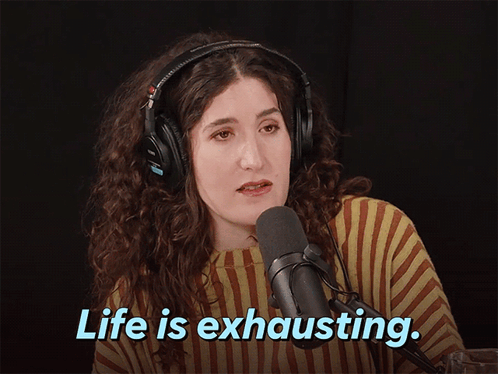 Woman with Headphones Talking Into Microphone