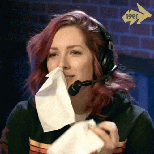 Woman With Headset Blowing Nose