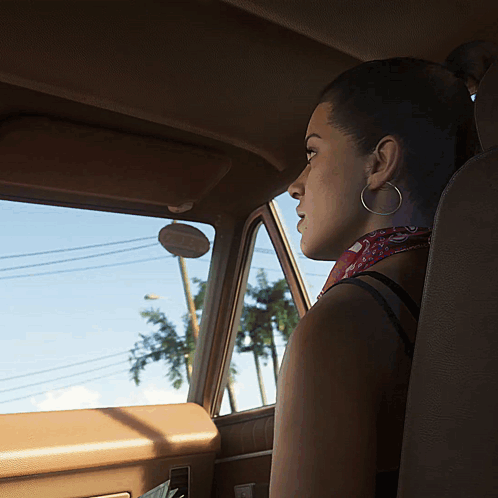 Woman With Hoop Earrings Sits in Car