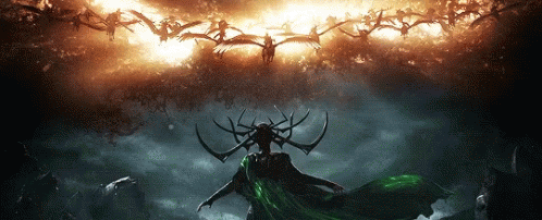 Woman With Horns And Green Cape In Front Of Birds GIF