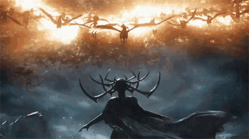 Woman With Horns Standing In Front Of Flock Of Birds GIF