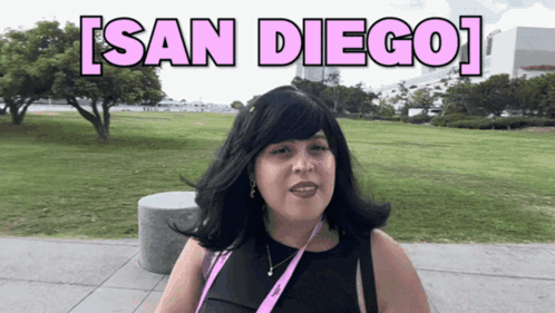 Woman With Lanyard In Park Saying San Diego GIF