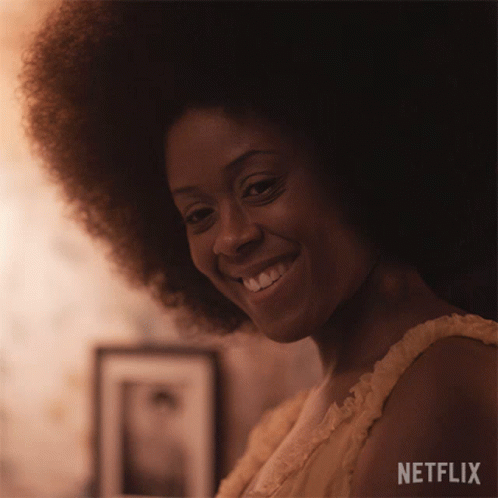 Woman With Large Afro Smiling in Netflix Ad