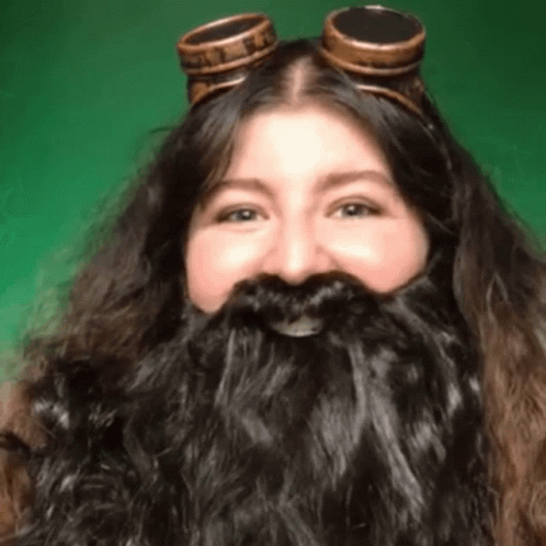 Woman with Long Beard and Goggles Smiling