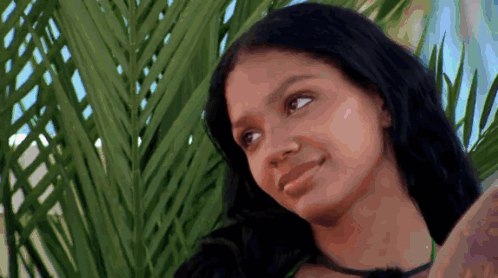 Woman With Long Black Hair Beside Palm Tree