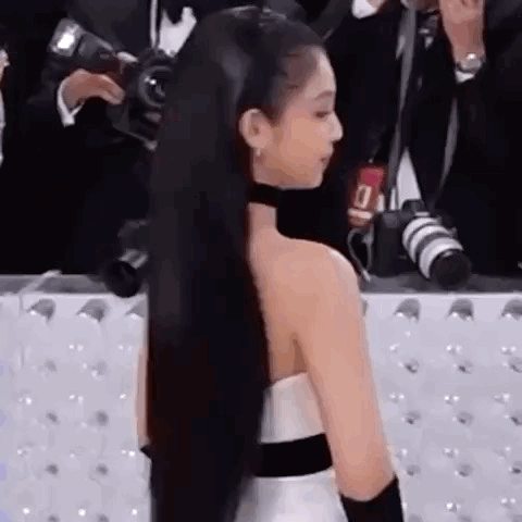 Woman with Long Black Hair in White Dress