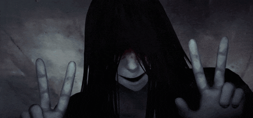 Woman with Long Black Hair Making Peace Sign