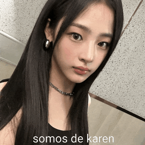Woman With Long Black Hair, Necklace and Earrings Says Somos de Karen