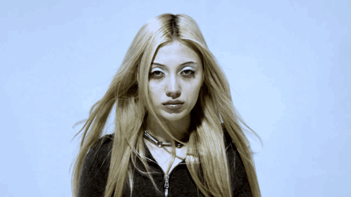 Woman With Long Blonde Hair And Choker Necklace GIF