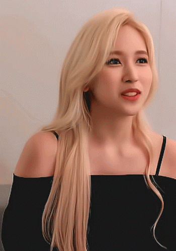 Woman With Long Blonde Hair In Black Off Shoulder Top GIF