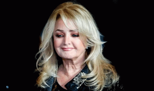 Woman With Long Blonde Hair on Black Background