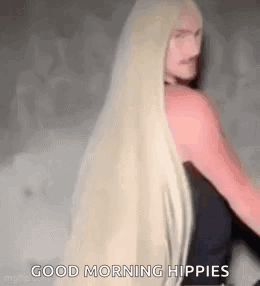Woman With Long Blonde Hair Standing GIF