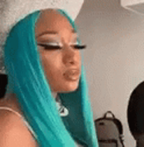 Woman With Long Blue Hair Making a Face
