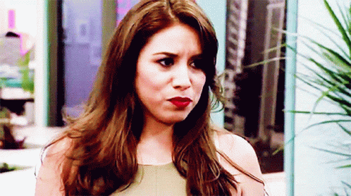 Woman With Long Brown Hair Making Serious Face