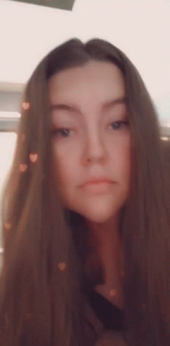 Woman With Long Brown Hair Taking Selfie With Hearts