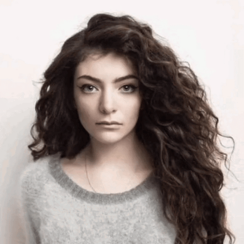 Woman With Long Curly Hair And Gray Sweater GIF