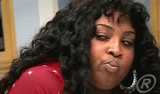 Woman With Long Curly Hair Blowing Kiss