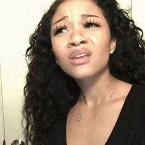 Woman With Long Curly Hair Making Funny Face GIF