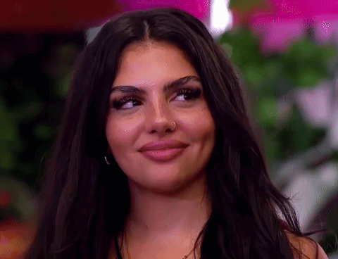 Woman With Long Dark Hair and Nose Ring Smiling