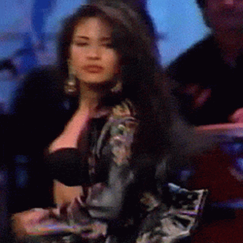Woman With Long Dark Hair in Black Bra and Floral Jacket
