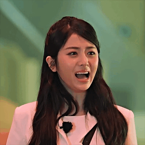 Woman With Long Dark Hair Making Funny Face GIF