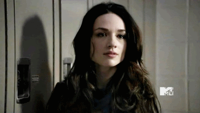 Woman With Long Dark Hair Standing in Front of Locker