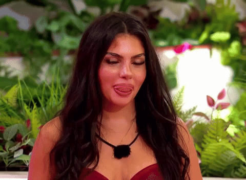 Woman with Long Dark Hair Sticking Out Tongue