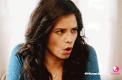 Woman With Long Dark Hair Surprised