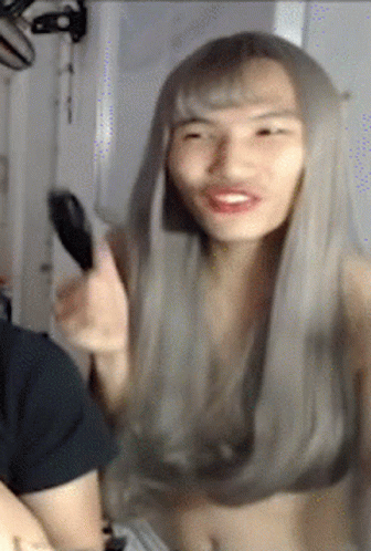 Woman With Long Grey Hair Smiling Holding Mirror GIF