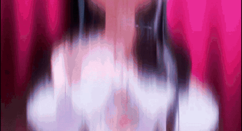 Woman With Long Hair Against Pink Curtain