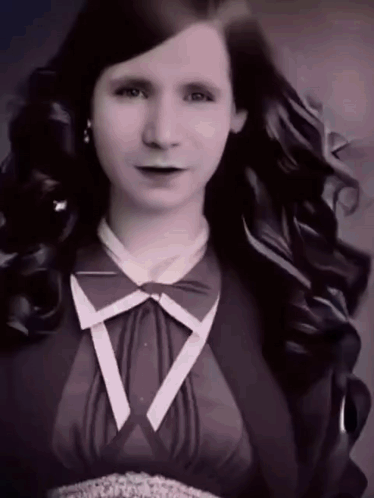Woman With Long Hair And Bow Tie GIF