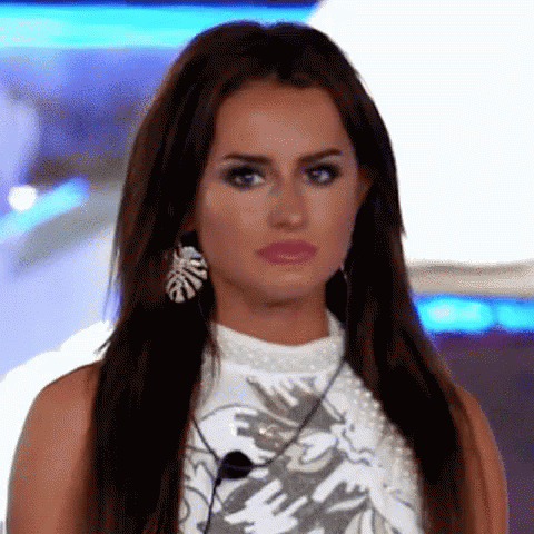Woman with Long Hair and Earrings Making Funny Face