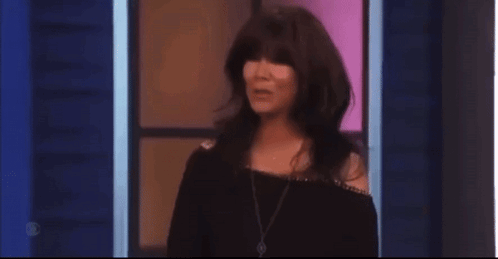 Woman With Long Hair Bangs Blue Wall Stage