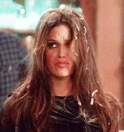 Woman With Long Hair Covered In Icing Making Funny Face GIF