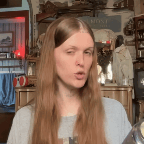 Woman With Long Hair in Front of Belmont Sign
