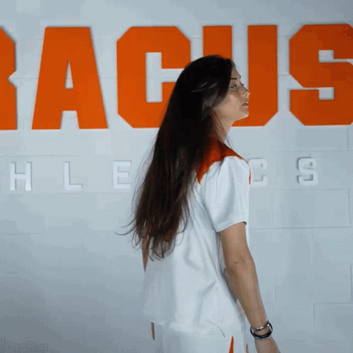 Woman with Long Hair in Front of Racus Wall