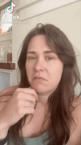 Woman With Long Hair Making Funny Face in TikTok Video