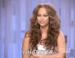 Woman With Long Hair Sitting And Saying Whatever GIF