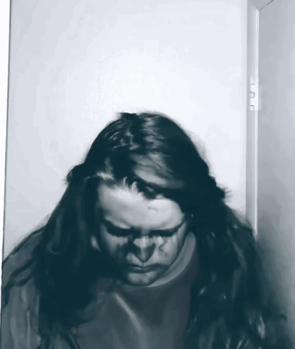 Woman With Long Hair Standing in Doorway