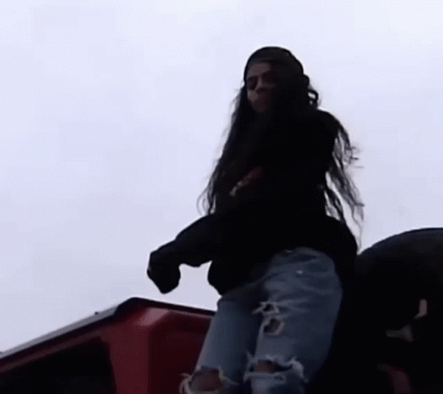 Woman With Long Hair Standing on Red Truck
