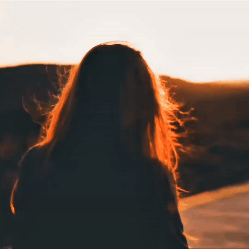 Woman with Long Hair Watching Sunset
