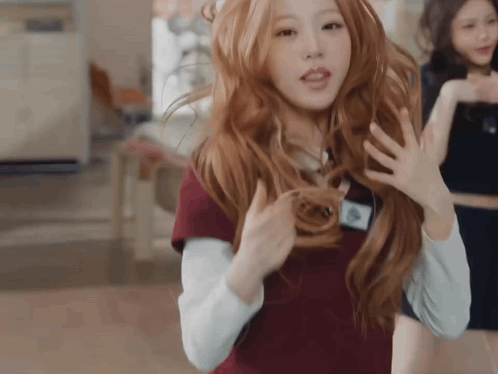 Woman with Long Red Hair and Name Tag A
