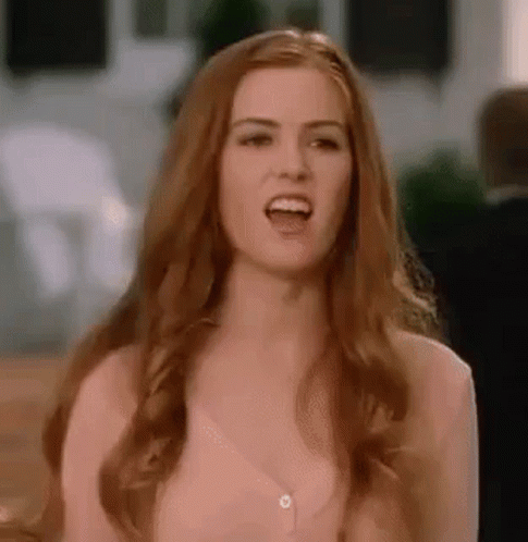 Woman With Long Red Hair Making Funny Face Laughing