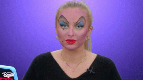 Woman With Makeup and Black Shirt Saying Beauty