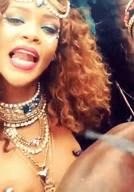 Woman With Many Necklaces And Earrings Making Funny Face GIF