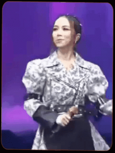 Woman With Microphone on Purple Stage