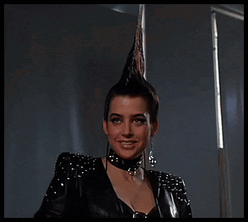 Woman with Mohawk Holding Scissors Saying Im Bad