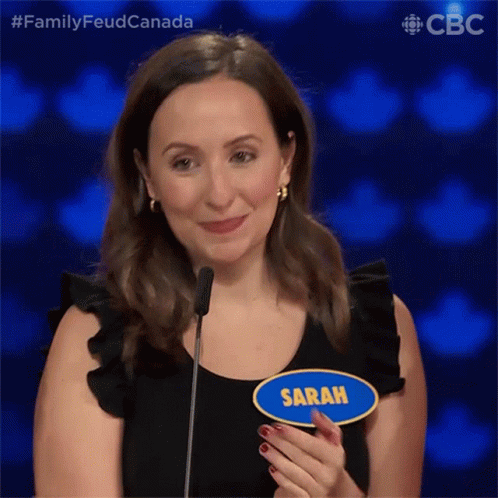 Woman With Name Tag Saying Sarah