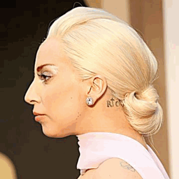 Woman With Neck and Ear Tattoo Close Up